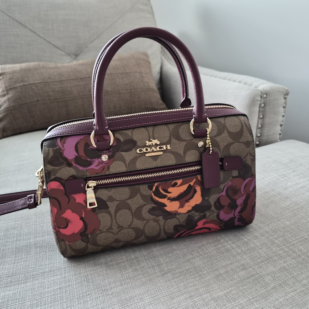 Coach Signature Floral Satchel in Brown with Purple and Pink Accents.